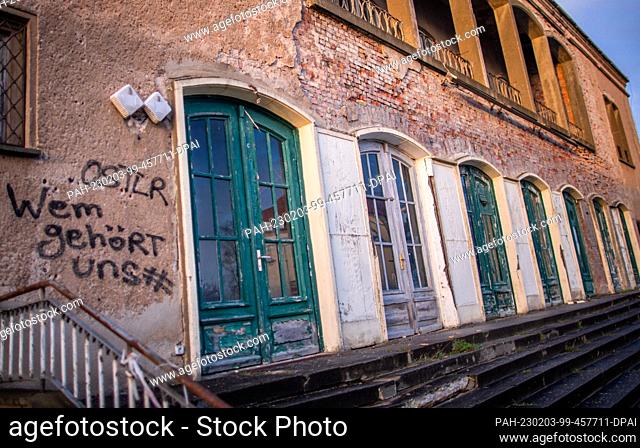 PRODUCTION - 17 January 2023, Mecklenburg-Western Pomerania, Sassnitz: A row of large double doors in the street front of the listed former culture house and...