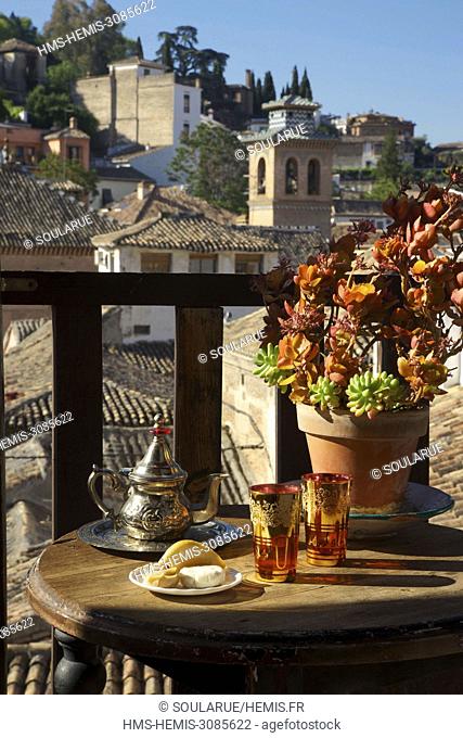 Spain, Andalusia, Granada, Albaicin, listed as World Heritage by UNESCO, arabic pastries and mint tea served on a small wood table on a balcony