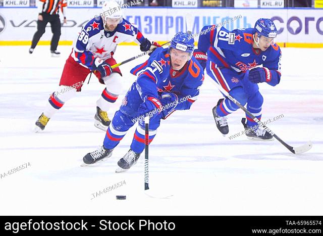 RUSSIA, ST PETERSBURG - DECEMBER 21, 2023: CSKA's Nikita Nesterov, SKA's Vasily Glotov and Marat Khayrullin (L-R) fight for the puck in a 2023/24 KHL Regular...