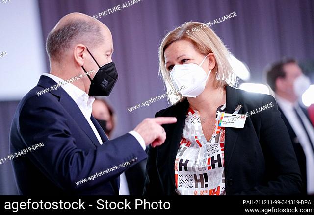 11 December 2021, Berlin: Chancellor Olaf Scholz (SPD) and Nancy Faeser (SPD), Federal Minister of the Interior and Home Affairs