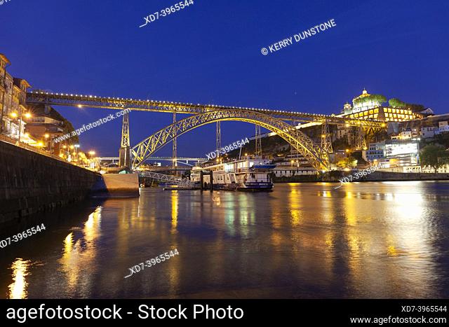 Europe, Portugal, Porto, Ribeira District; Looking across the Douro River at Night towards the Vila Nova de Gaia and Luís I Bridge