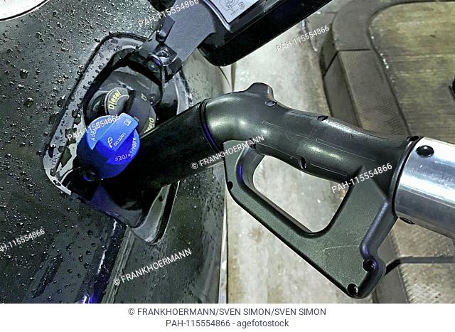 Adnlue refueling. Adblue fuel nozzle is in the filler neck, filler neck for Adblue a diesel car, which is located next to the filler neck for diesel fuel