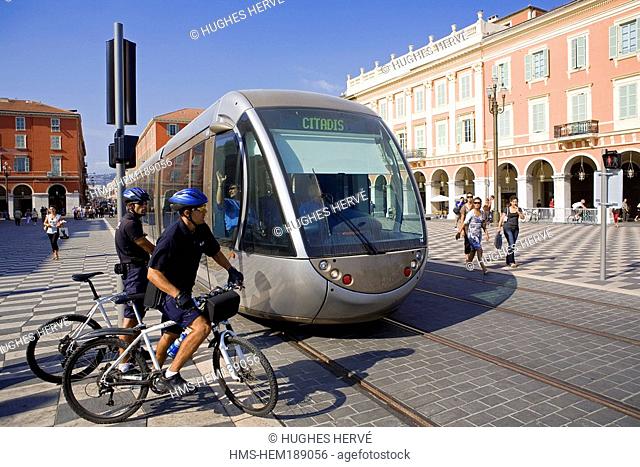 France, Alpes Maritimes, Nice, Old Town, Place Massena, streetcar and local police cycling