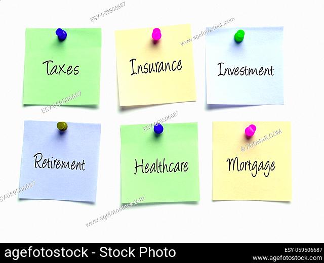 Six post-it notes as a reminder of taxes, insurance, investment, retirement, healthcare and mortgage obligations
