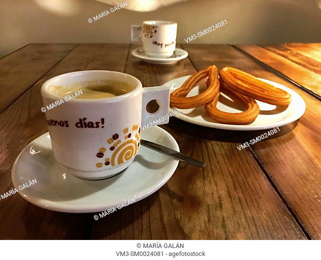 Two cups of coffee with churros. Madrid, Spain