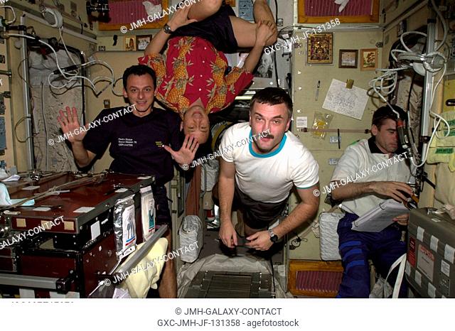 European Space Agency (ESA) astronaut Pedro Duque (left) of Spain; astronaut Edward T. Lu, Expedition 7 NASA ISS science officer and flight engineer; cosmonaut...