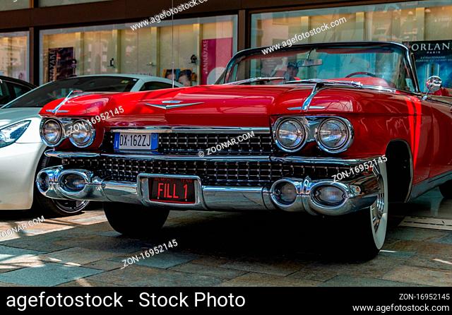 A picture of the front side of a red Cadillac 1959 Series 62 Convertible