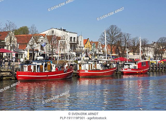 Traditional fishing boats in the canal der Alte Strom / Old Channel at Warnemünde in the city Rostock, Mecklenburg-Vorpommern, Germany