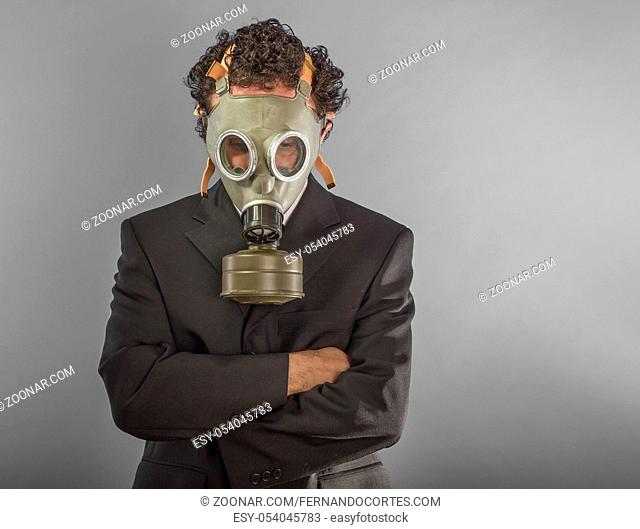 Businessman with gas mask, concept business dangerous for the environment or for society