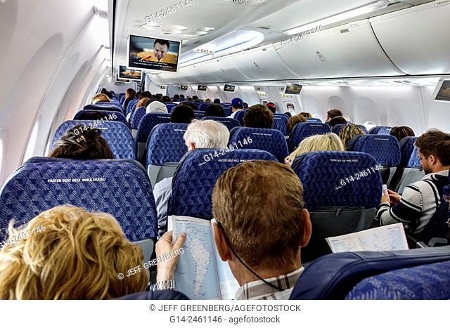 Florida, Miami, International Airport, MIA, American Airlines, commercial airliner, plane, flight, passengers, economy class, cabin, seated, onboard