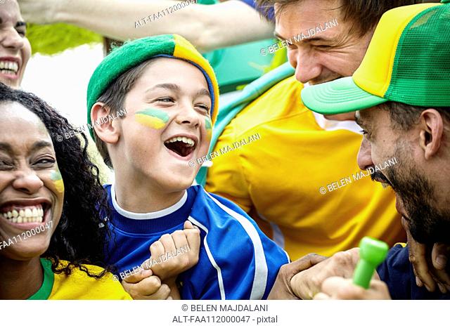 Brazilian football fans celebrating victory at match