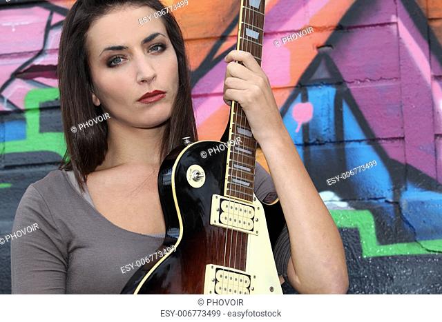 Brunette with electric guitar