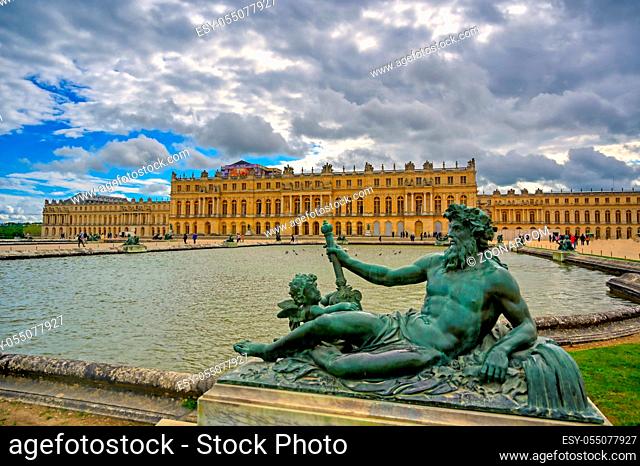 Versailles, France - April 24, 2019: The statues and fountains in and around the garden of Versailles Palace on a sunny day outside of Paris, France