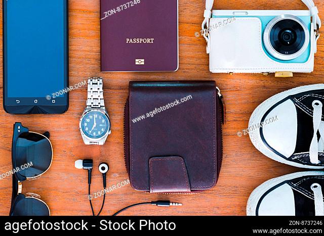travel background with Items photo camera, passport, wallet , Watches, headphones, shoes, sunglasses, smartphone