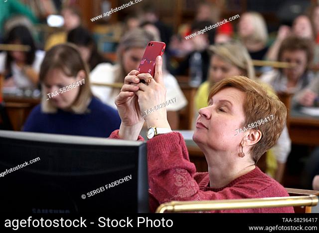 RUSSIA, MOSCOW - APRIL 8, 2023: People take the 2023 Total Dictation, an annual Russian language test, at the Pashkov House. Sergei Fadeichev/TASS