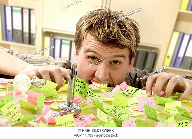 Man drowning in his post-its.  - ROETGEN, NRW, GERMANY, 22/01/2005