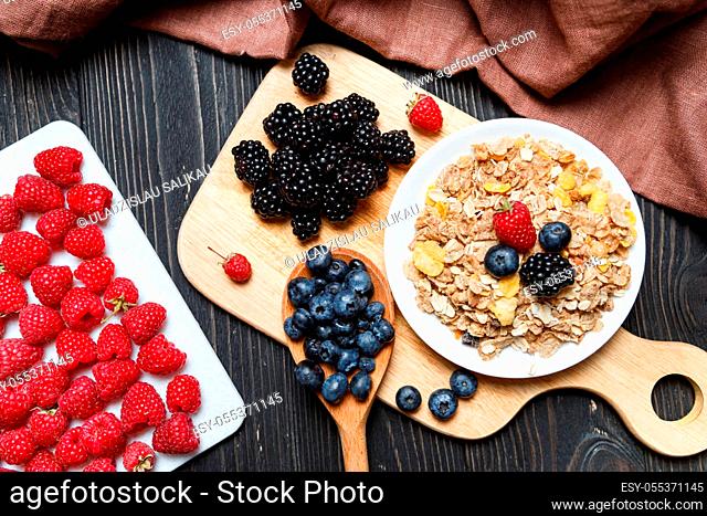 Cereal. Breakfast with muesli and berries. Top view