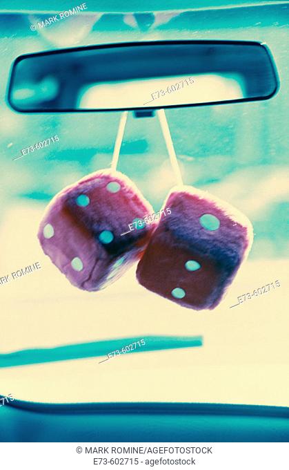 Fuzzy dice hanging from rearview mirror