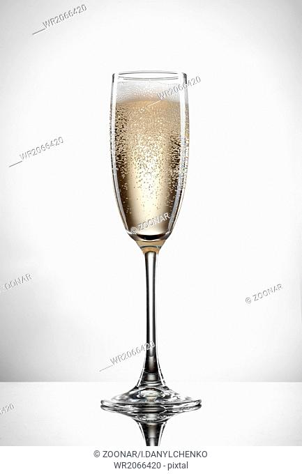 champagne in glass isolated on white