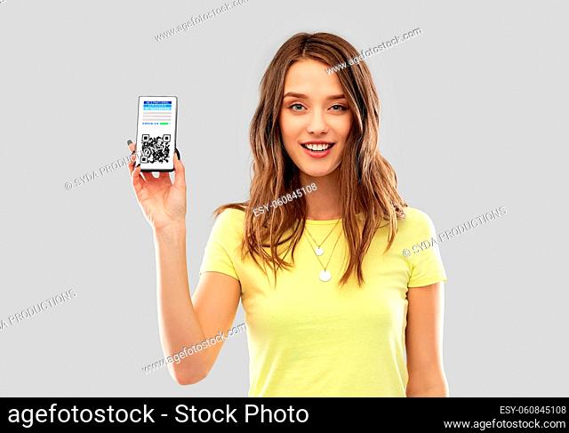 woman with virtual immunity passport on smartphone