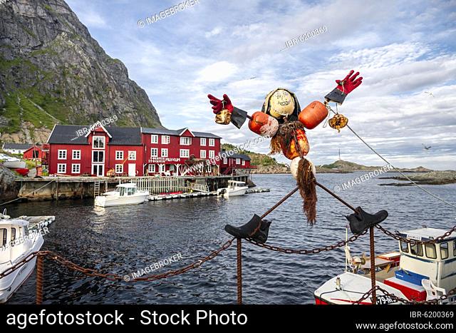 Funny figure, Traditional red stilt houses, typical fishermen huts, Å i Lofoten, Lofoten, Nordland, Norway, Europe