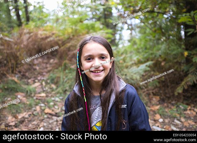 Portrait of little girl in the woods