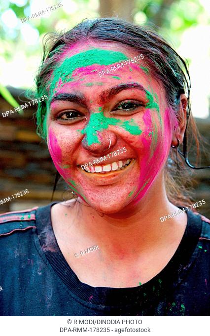 Indian girl face smeared with colors, Holi Festival, India, Asia, MR#364