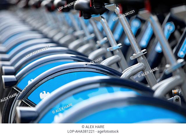 England, London, London. A row of Barclays Cycle hire scheme bikes in a docking station