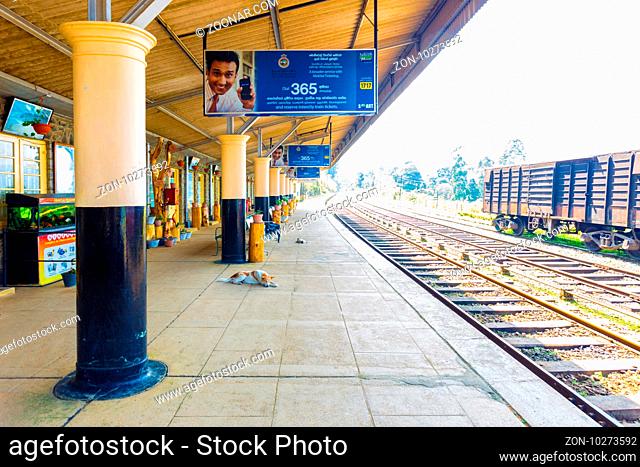 Diyathalawa, Sri Lanka - January 9, 2015: Train tracks and empty platform of railway station at Diyathalawa, a travel destination for local tourists