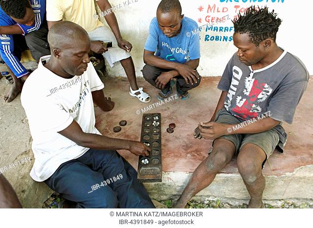 Men playing Bao board game, Watamu, Kilifi County, Kenya