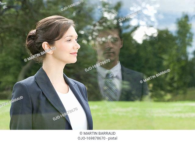 Businesswoman looking out window