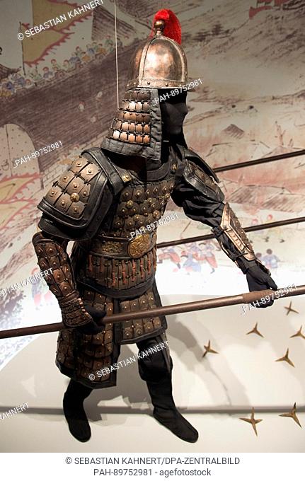 A figure wearing a replica of the armour of a Chinese officer is on display in the exhibition 'The City Wall of Nanjing - The Ming Emperors' Protective Wall' at...