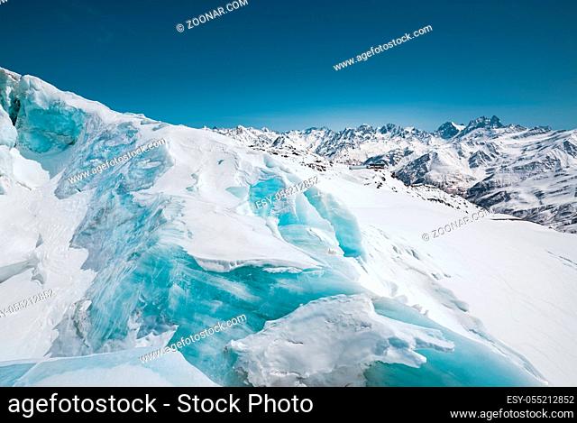 A close-up of snow-covered cracks in the Elbrus volcano glacier. North Caucasus