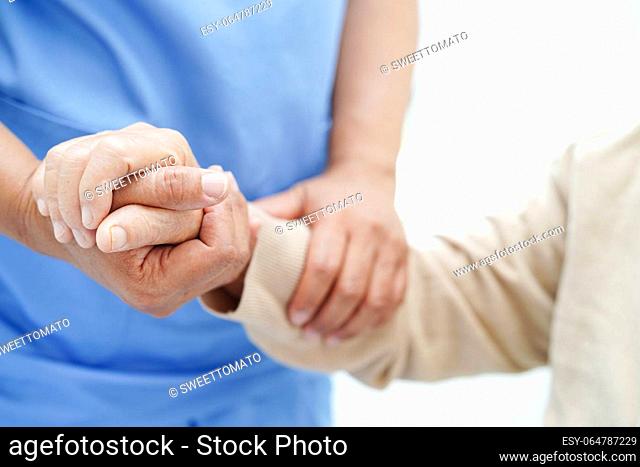 Doctor holding hands Asian elderly woman patient, help and care in hospital