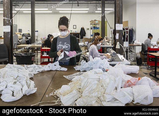 Pontiac, Michigan, USA - 2 April 2020 - Workers at Detroit Sewn, a contract sewing company, produce medical masks for medical professionals during the...
