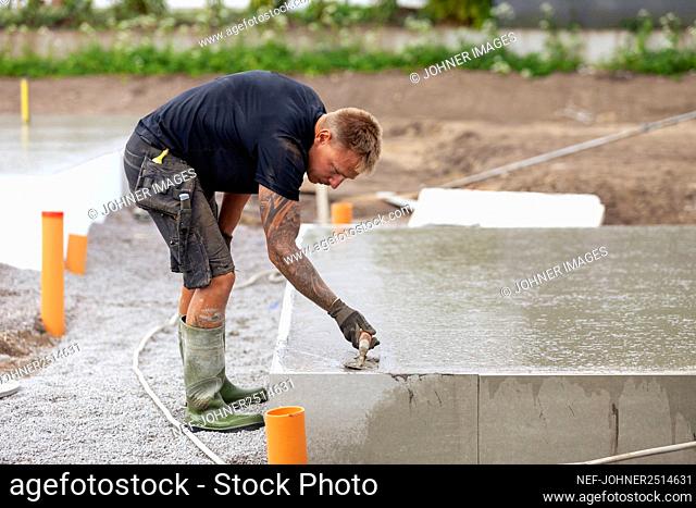 Worker preparing foundations