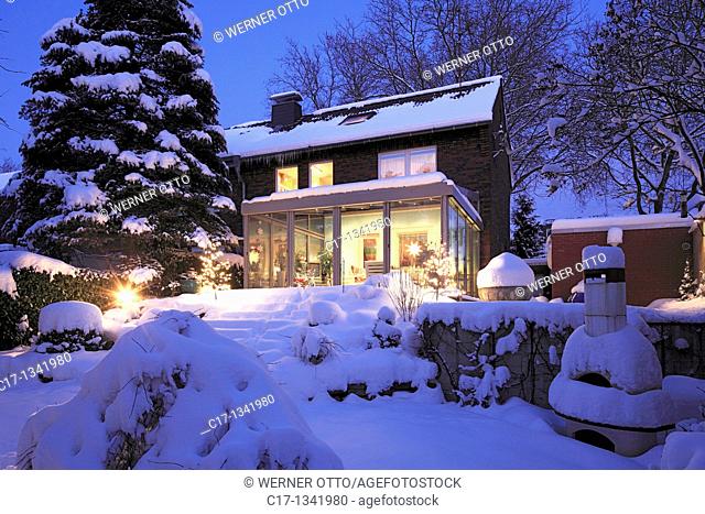 residential house with winter garden, single-family home, row house, garden side, flower garden, outside staircase, perron, severe winter, snow-covered, evening