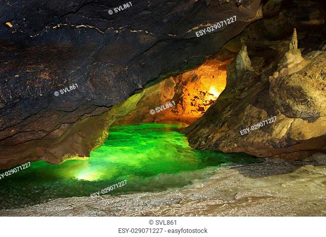Karst cave with underground river and speleothems. Kizil-Koba (Red cave), Crimea