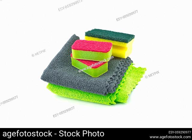 Colorful microfiber rugs and sponges isolated on a white background, House cleaning supplies