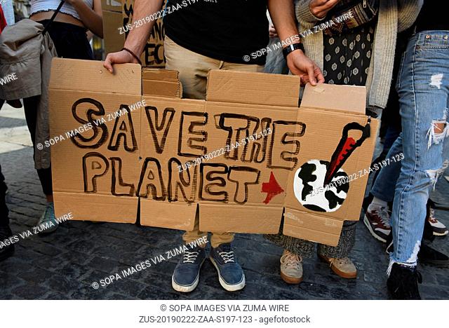 February 22, 2019 - Barcelona, Barcelona, Spain - A man is seen holding a placard reading 'Save the planet' during the protest