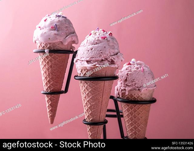 Vegan strawberry coconut ice cream in waffle cones