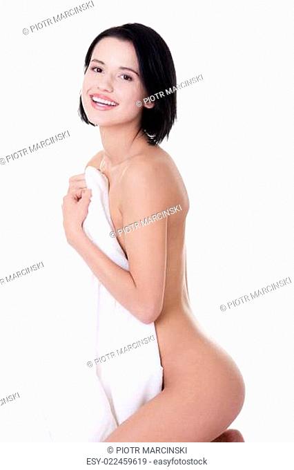 Sexy nude woman covering her body with sheet