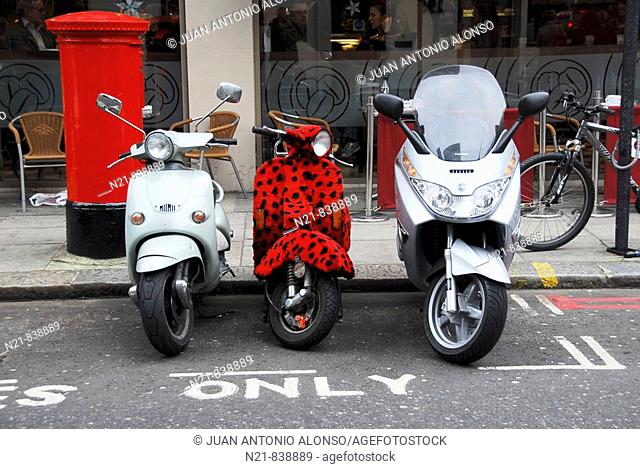 Scooters parked on a street in London, England