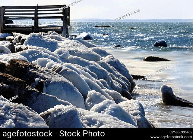 Rocks iced over from saltwater spray along Buzzards Bay shoreline