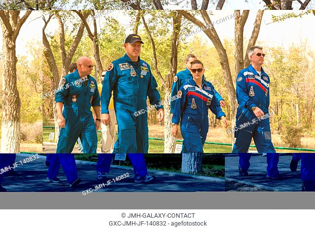 Behind their Cosmonaut Hotel crew quarters in Baikonur, Kazakhstan, Expedition 41 Flight Engineer Barry Wilmore of NASA (front row, left)