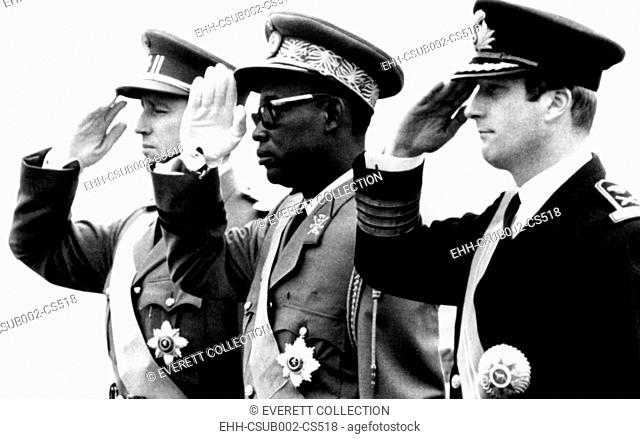Congolese President Joseph Mobutu flanked by Belgian's King Baudouin (left) and Prince Albert. Nov. 3, 1969. It was the first official visit of a Congolese head...