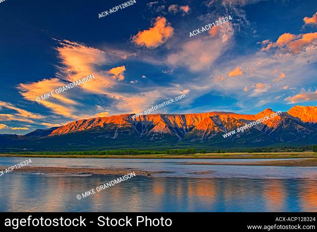 Clouds reflected in Abraham Lake at sunrise. The Canadian Rocky Mountains. David Thompson Highway Alberta Canada