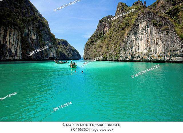 Long tail boats in a secluded bay, Ko Phi Phi Iceland, Phuket Thailand, Southeast Asia, Asia