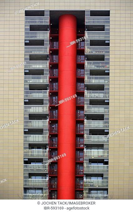 Facade of a modern apartment building with red elevator shaft, Rotterdam, The Netherlands, Europe