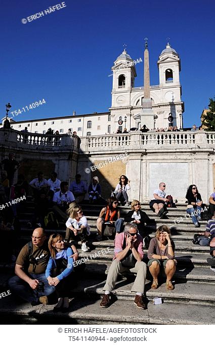 People enjoy the Sun at the Spanish Steps in Rome